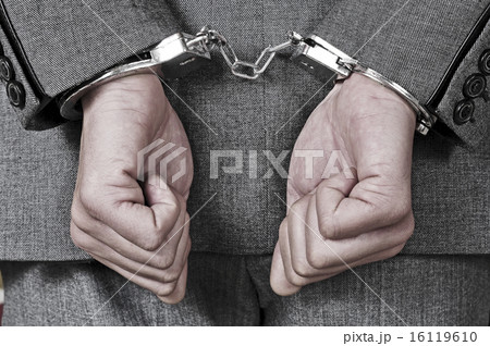 handcuffed man handcuffed man 16119610