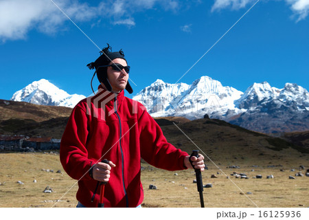 Hiker in the mountains landscape 16125936