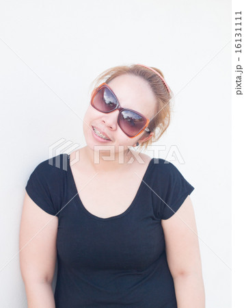 Young Asian lady wearing sunglasses smiling face Young Asian lady wearing sunglasses smiling face 16131111