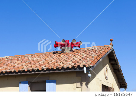 Fire siren on house roof 16135647