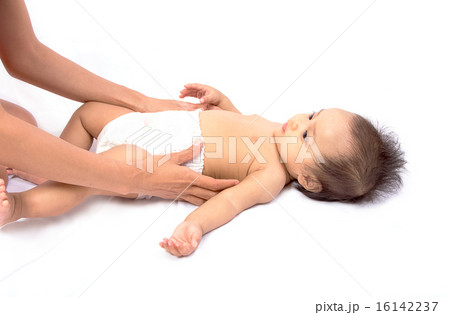 woman dresses to the baby diaper 16142237