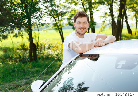 Happy young man near his car Happy young man near his car 16143317