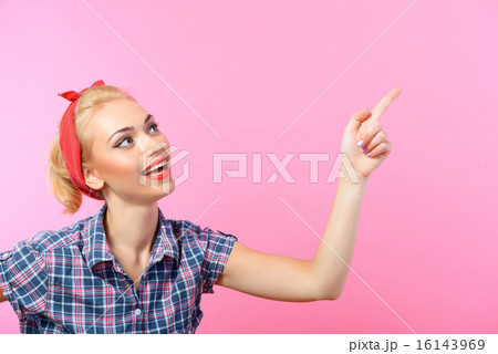 Beautiful pin up girl isolated on pink Beautiful pin up girl isolated on pink 16143969
