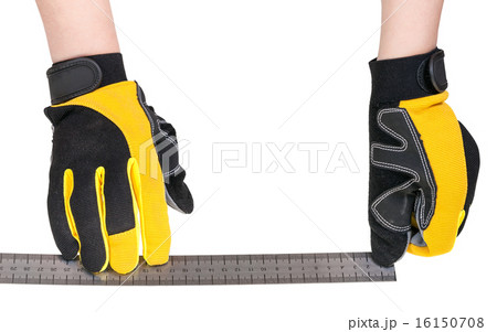 worker hands in safety gloves with ruler isolated 16150708