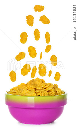 Flying corn flakes in a bowl isolated on white  16152685