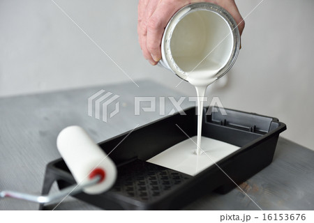 Pouring paint into a painting tray 16153676