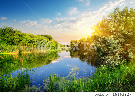 Yellow sunset over river 16163327