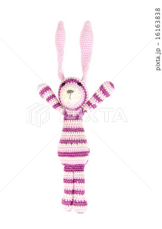 Funny knitted rabbit toy is jumping, isolated Funny knitted rabbit toy is jumping, isolated 16163838