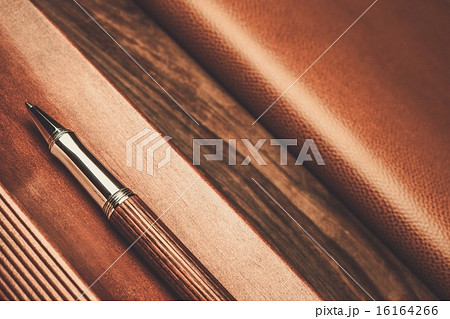 Luxurious rollerball pen on a wooden background 16164266