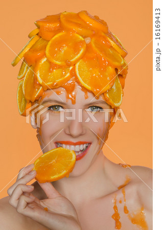 Woman eats orange Woman eats orange 16169413
