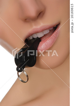closeup of female mouth and whistle closeup of female mouth and whistle 16169615