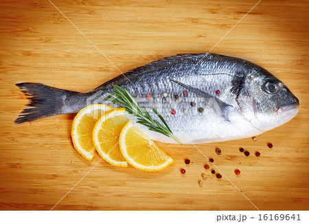 Fresh fish dorado on wooden background 16169641