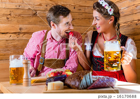Couple having dinner at mountain hut in alps 16170688