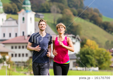 Couple doing sport running in the mountains 16170700