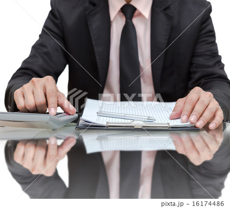 Businessman calculating the information with file pad 16174486