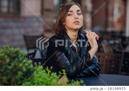 beautiful glamorous brunette smoke electronic cigarette beautiful glamorous brunette smoke electronic cigarette 16198935