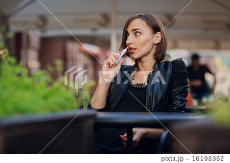 beautiful glamorous brunette smoke electronic cigarette beautiful glamorous brunette smoke electronic cigarette 16198962