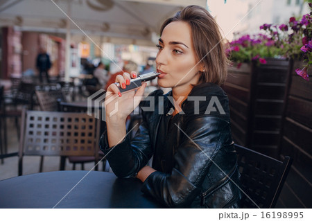 beautiful glamorous brunette smoke electronic cigarette beautiful glamorous brunette smoke electronic cigarette 16198995