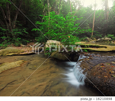 Waterfall in the forest nature background 16210898