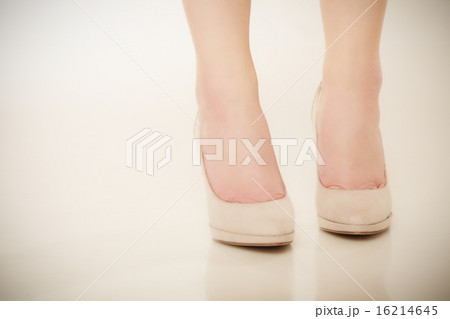 Closeup of female feet in beige high heels. 16214645