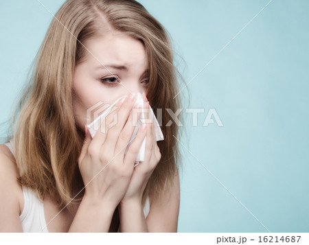 Flu allergy. Sick girl sneezing in tissue. Health Flu allergy. Sick girl sneezing in tissue. Health 16214687