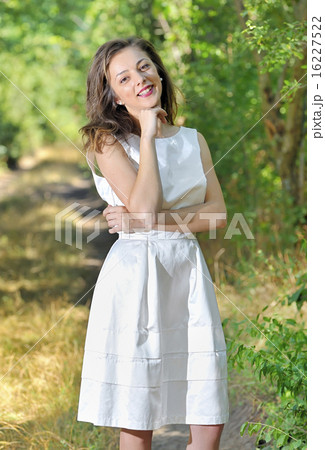 beauty girl in a fashioned dress in a forest 16227522