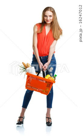 Happy woman holding a basket full of healthy food 16247012
