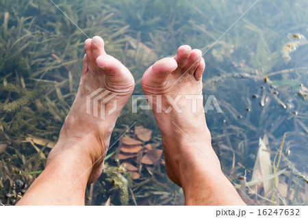 Legs and feet relaxing at fresh water pond Legs and feet relaxing at fresh water pond 16247632