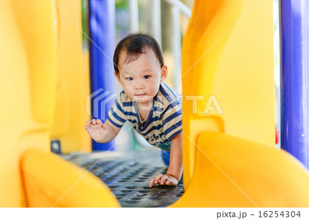 Asian girl playing on playground. 16254304