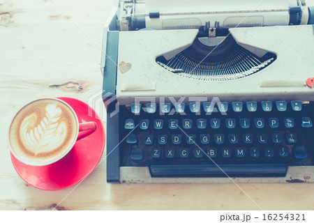 Latte art in red coffee cup and Typewriter  Latte art in red coffee cup and Typewriter  16254321
