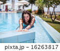 Young woman laying on the swimming pool wall 16263817