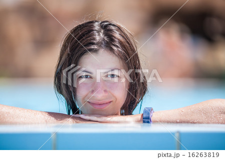 Young woman relaxing in the water Young woman relaxing in the water 16263819
