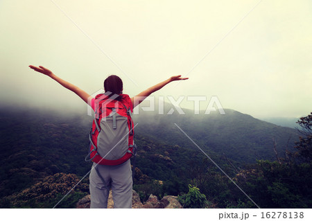 cheering woman enjoy the beautiful view  16278138