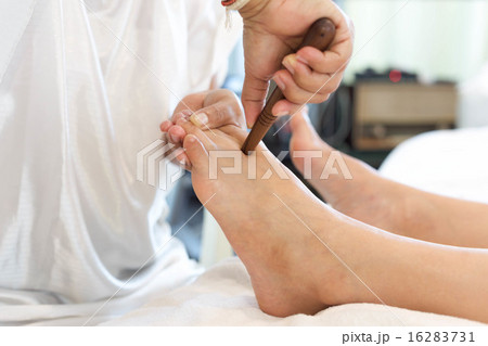 Asian woman having a reflexology foot massage 16283731