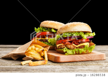 Delicious hamburger and fries Delicious hamburger and fries 16286538