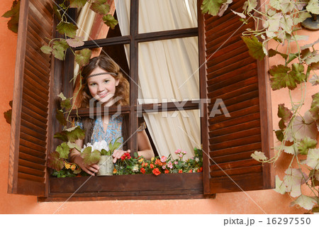 Young girl near the window Young girl near the window 16297550