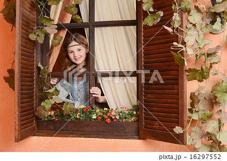 Young girl near the window Young girl near the window 16297552