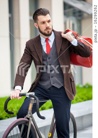 Handsome businessman and his bicycle Handsome businessman and his bicycle 16299262