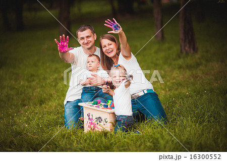 Happy family with nesting box and paints Happy family with nesting box and paints 16300552