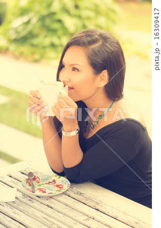 Coffee. Beautiful Girl Drinking Tea or Coffee in Cafe. Beauty Mo Coffee. Beautiful Girl Drinking Tea or Coffee in Cafe. Beauty Mo 16309417
