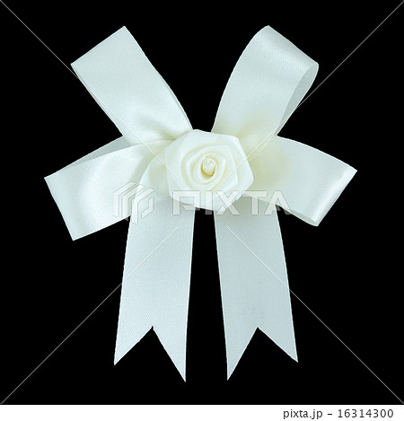 White satin gift bow. Ribbon. Isolated on black White satin gift bow. Ribbon. Isolated on black 16314300