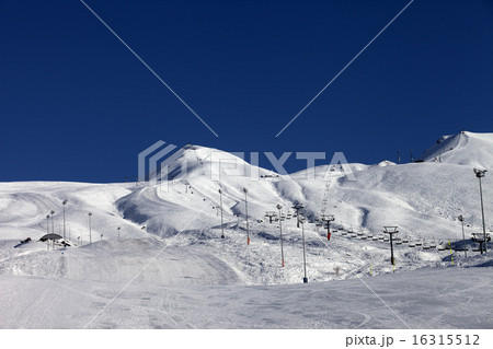 Winter mountains and ski slope at sun day 16315512
