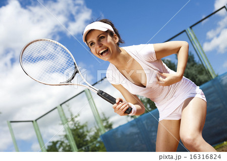 Girl playing tennis on the court Girl playing tennis on the court 16316824