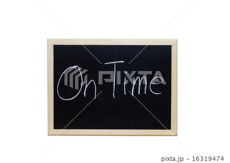 On Time written with white chalk on blackboard. 16319474