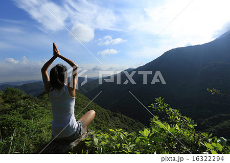 young fitness woman practice yoga at mountain peak 16322294