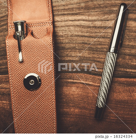 Luxurious rollerball pen on a wooden background 16324334
