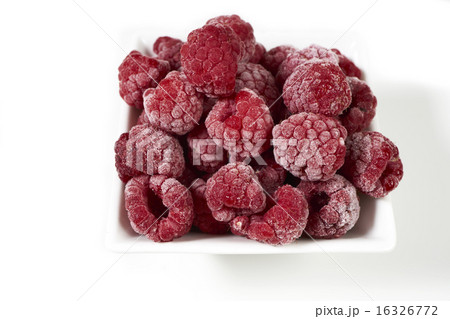 Frozen raspberries in a white porcelain dish Frozen raspberries in a white porcelain dish 16326772