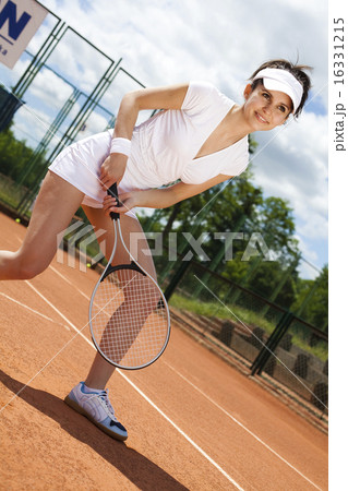 Young woman playing tennis, natural colorful tone Young woman playing tennis, natural colorful tone 16331215