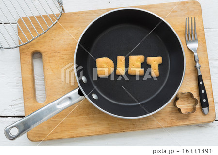 Alphabet crackers word DIET putting in pan Alphabet crackers word DIET putting in pan 16331891