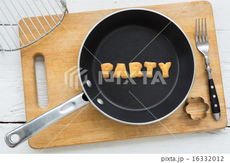 Cookie biscuits word PARTY in frying pan 16332012